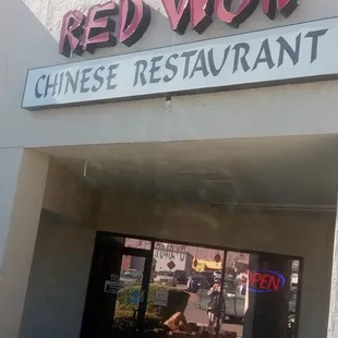 Outside entrance, in the corner of an L-shaped strip mall