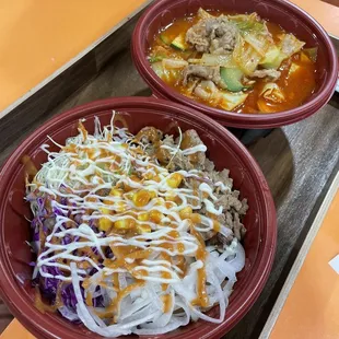 two bowls of food on a table