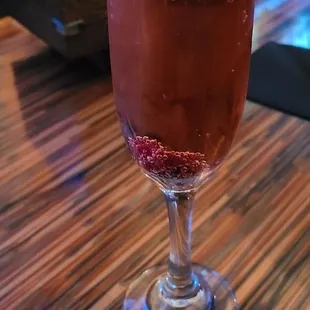Poinsettia Prosecco &amp; cranberry juice, garnished with craisins