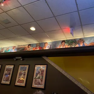 a mural of people on the wall