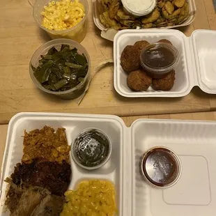 Pickles, hush puppies, a pint of greens and mac &amp; cheese, with meat combination two sides and sauce