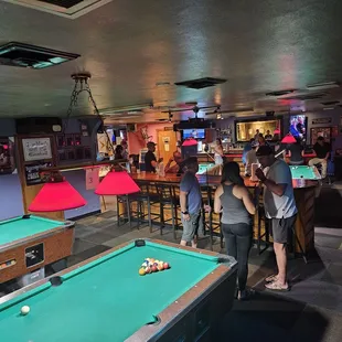 Smoking area has bar, juke box and pool tables