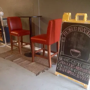a chalk board and chairs