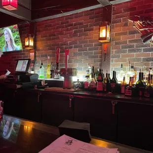 a bar with bottles of alcohol