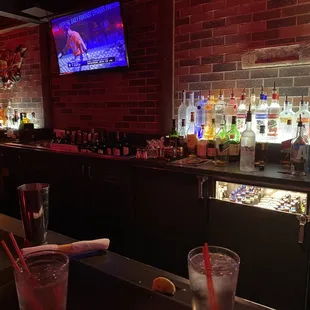 a bar with a television in the background