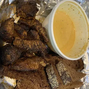 Steak tips!!! Comes with sauce and pumpernickel