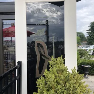 the reflection of a person in the window