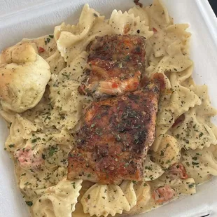 Shrimp bow tie pasta topped with a sweet chilli glaze salmon