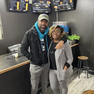 Owners inside restaurant