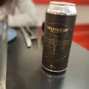 a can of beer on a table