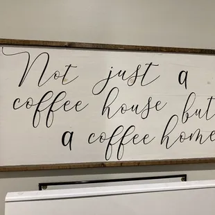 "Not just a coffee house, but a coffee home" sign.