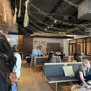 a group of people in a coffee shop