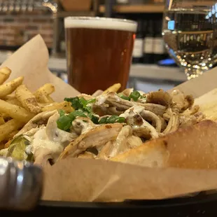 a plate of food and a glass of beer