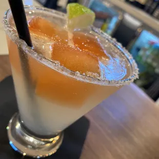 a margarita with a lime garnish