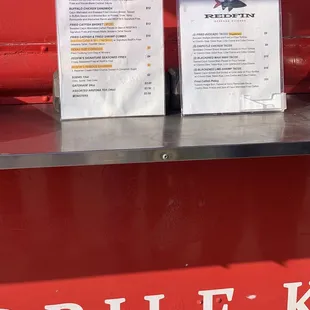 two menus on the counter