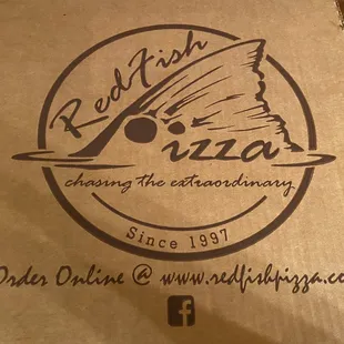 a pizza box on a table