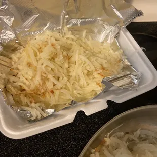 a container of shredded cheese and onions