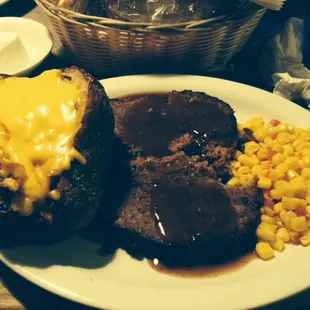 Baked meatloaf with loaded baked and corn
