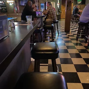 people sitting at a bar
