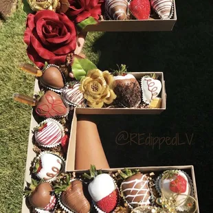 a box of chocolate covered strawberries and strawberries