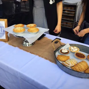a table with pies and pastries