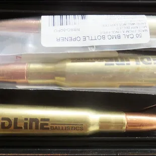 &quot;Big boy&quot; toys:  Bottle openers made from a .50 BMG cartridge, complete with monster bullet.  Great way to open a conversation!