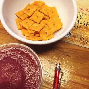 a bowl of crackers and a bowl of jam