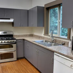 Kitchen with double oven and two refrigerators