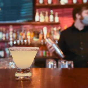 a bartender behind the bar