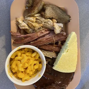 a plate of meat and macaroni and cheese