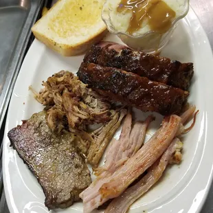 barbecue sampler for one with side and bread.