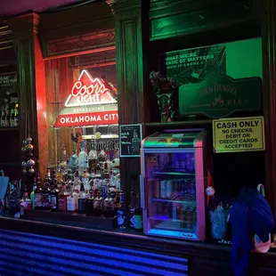a bar with neon signs