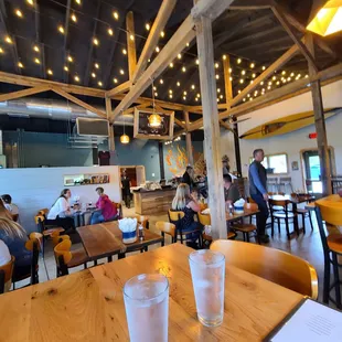 people eating and drinking in a restaurant