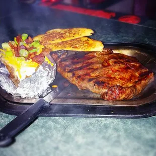 steak, potatoes, and corn