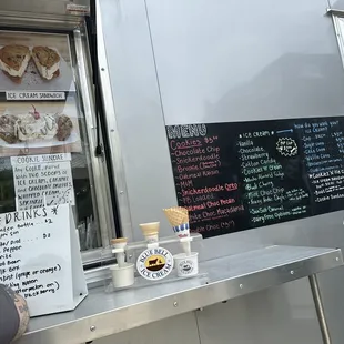 a food truck with menus on it