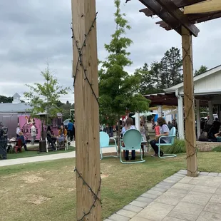 Bar and sitting area with food trucks in background