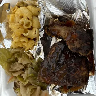 Jerk chicken. Mac and cheese. Cabbage.