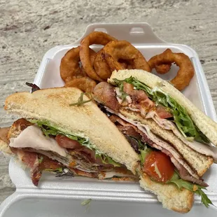 a sandwich and onion rings