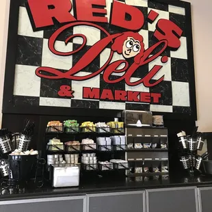 a sign for a deli and market