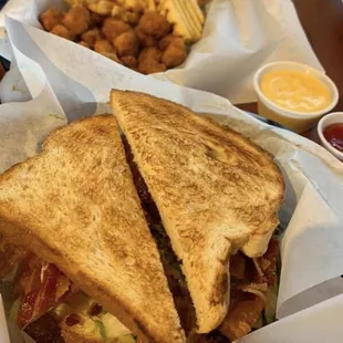 BLTA, waffle fries, and spicy chicken nuggets.