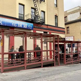 people sitting at a bus stop