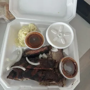 4 meat plate with brisket and ribs + potato salad and creamed corn