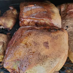 a variety of meats on a grill