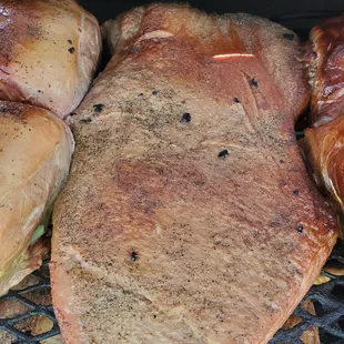 a variety of meats on a grill