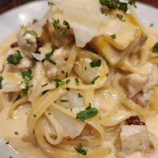 a pasta dish with chicken and cheese