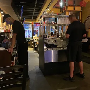 two men preparing food