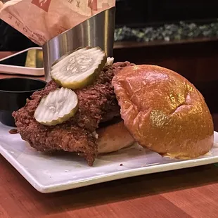 a fried chicken sandwich with pickles