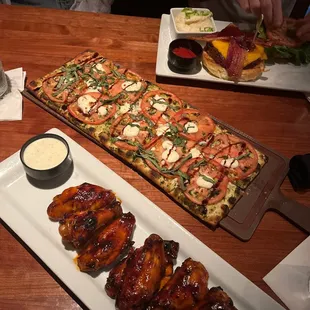 Margherita pizza, Buffalo chicken wings, burger