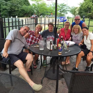 a group of people sitting around a table