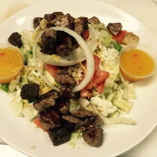 a plate of meat and vegetables